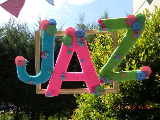 Fun yarn wrapped letters at a Lalaloopsy party! See more party ideas at CatchMyParty.com! #partyideas #lalaloopsy