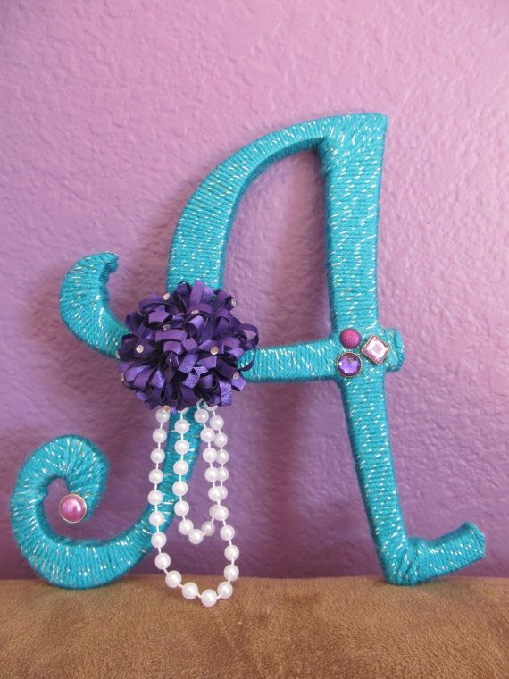Fancy custom yarn wrapped letters found on Etsy! Perfect for a nursery or kids' room!